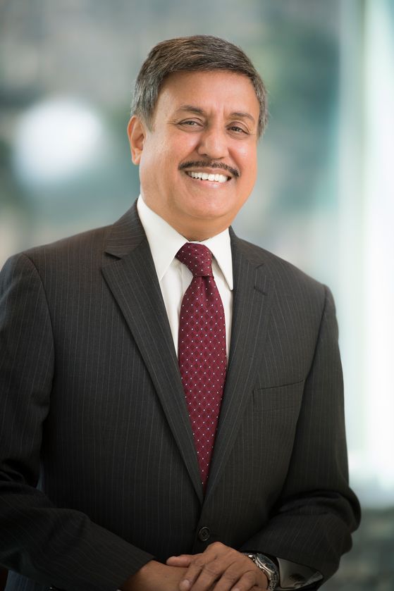 Ram Raju, MD, wearing a red tie